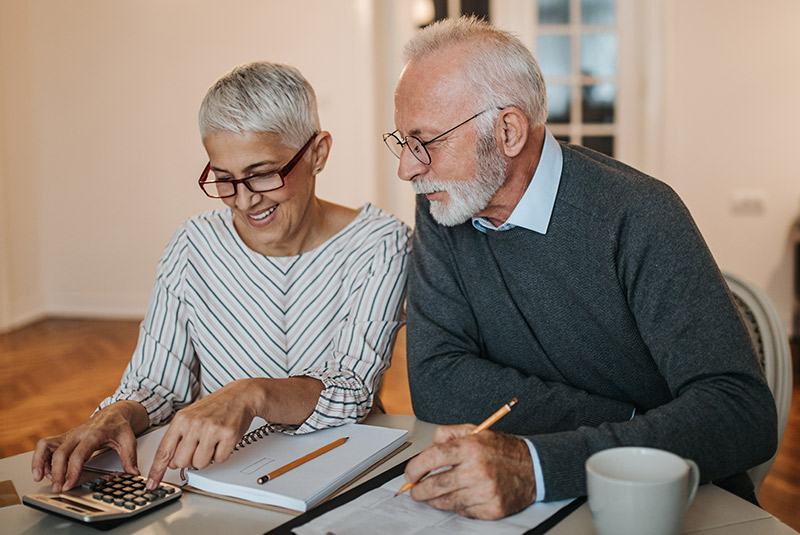 Very nice couple at home working on dental implant financing
